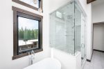 The master ensuite offers a soaker tub, walk in tile steam shower & expansive vanity.